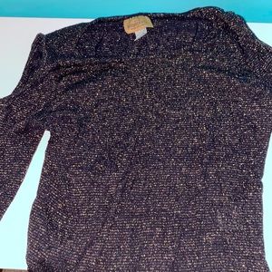 This is a cute black sweater with shoulder cutouts. It has sparkly black accents